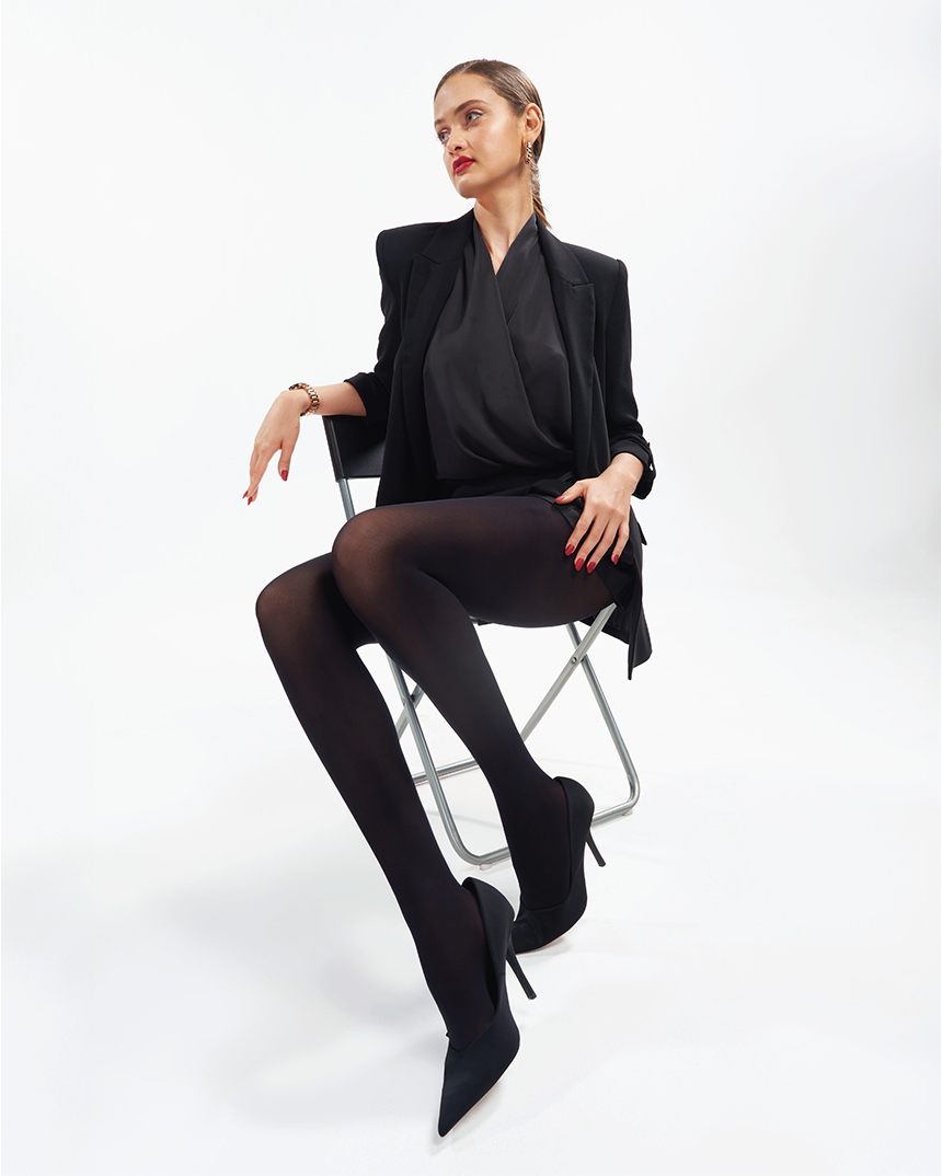 Model wearing black stockings in a studio product shoot for Keepups